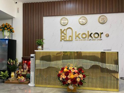 a store front with a flower arrangement in front of it at KOKORO HOTEl & HOMESTAY in Cao Bằng
