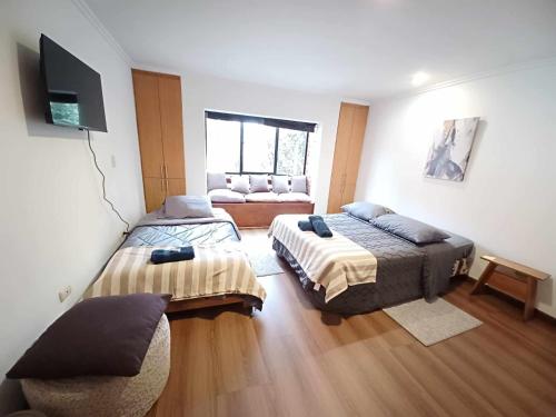 Ένα ή περισσότερα κρεβάτια σε δωμάτιο στο Hostel Mochiliers Bed and Breakfast