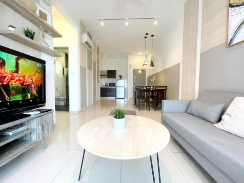 a living room with a couch and a table at MesaHill Homestay, Nilai by S&T Homez in Nilai
