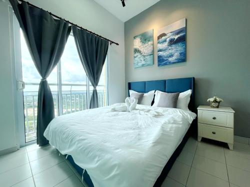 a bedroom with a large bed and a window at MesaHill Homestay, Nilai by S&T Homez in Nilai