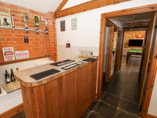 a kitchen with a counter top in a room at Hill House Farm in Northampton