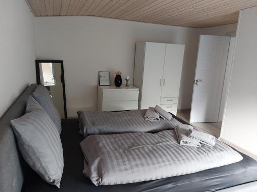 a bedroom with a bed with pillows on it at Venos Home in Lemvig