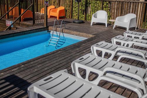 a group of chairs and a swimming pool at Mokre 22 in Bielsk Podlaski