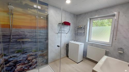 a bathroom with a shower and a sink at Pension Haus Germania in Erfurt