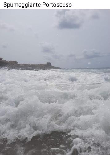 a body of water with foam on top of it at B&B Nuovo Capo Altano in Portoscuso