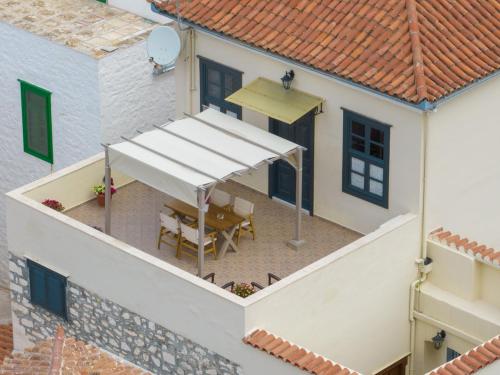 an overhead view of a house with a white awning at Phaedra Hotel in Hydra