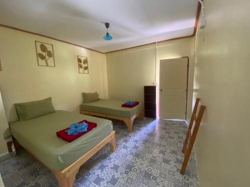 Postel nebo postele na pokoji v ubytování PD Guesthouse