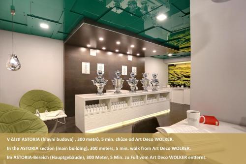 a room with several trophies on a wall at Art Deco WOLKER by ASTORIA Hotel & Medical Spa in Karlovy Vary
