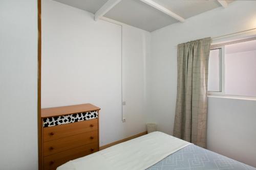 Ένα ή περισσότερα κρεβάτια σε δωμάτιο στο Apartamentos Fani