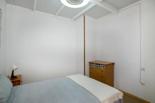 Ένα ή περισσότερα κρεβάτια σε δωμάτιο στο Apartamentos Fani