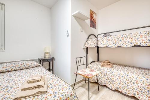 Ένα ή περισσότερα κρεβάτια σε δωμάτιο στο Merlo Apartments