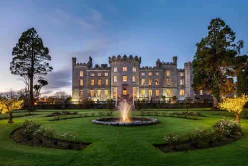 a large castle with a fountain in front of it at Markree Castle in Sligo