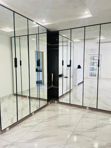 a large room with glass doors on the wall at Mafjoint3 in Zeerust