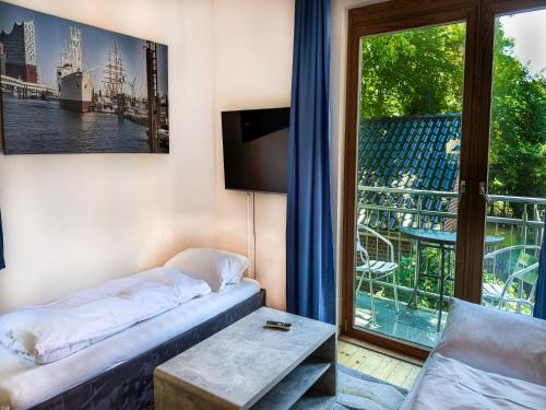 Ένα ή περισσότερα κρεβάτια σε δωμάτιο στο Hansa Apartments Hamburg
