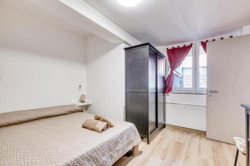 Ένα ή περισσότερα κρεβάτια σε δωμάτιο στο Merlo Apartments