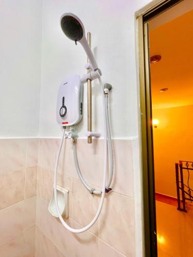 a shower head on a wall in a bathroom at LEGOLAND with 10-15min drive from Bukit Indah Near Medini Nusajaya in Johor Bahru