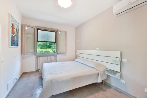 Ένα ή περισσότερα κρεβάτια σε δωμάτιο στο Villa Lorenzo - Goelba