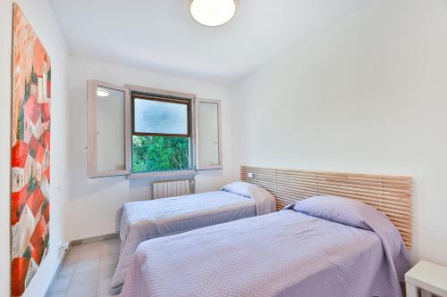 Ένα ή περισσότερα κρεβάτια σε δωμάτιο στο Villa Lorenzo - Goelba