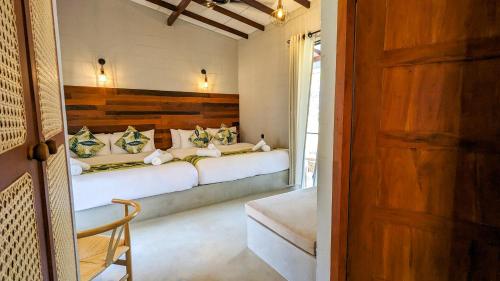 a bedroom with two beds in a room at Misty Villa by DBI in Pussellawa