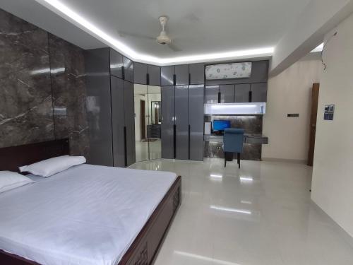 a bedroom with a large white bed in a room at Elegant Secured Family Apartment with Open Space in Dhaka