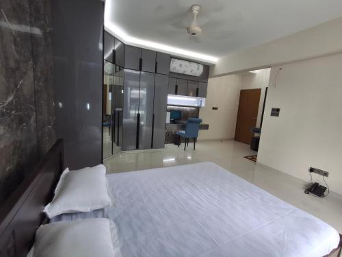 a bedroom with a large bed in a room at Elegant Secured Family Apartment with Open Space in Dhaka