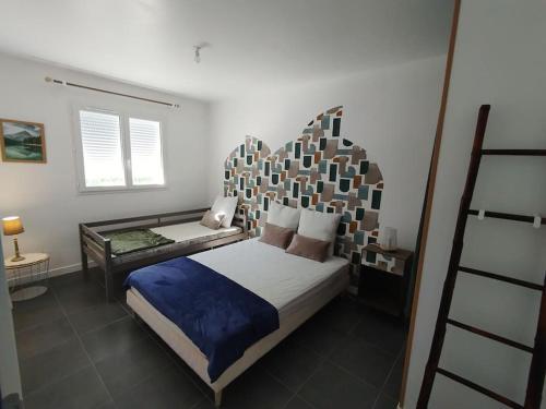 Ένα ή περισσότερα κρεβάτια σε δωμάτιο στο La Maison Vanista