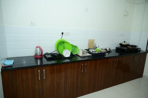 Kuchyň nebo kuchyňský kout v ubytování Windfall Service Apartment