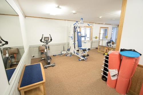 a room with a gym with exercise equipment in it at Värdshuset Flottaren in Vansbro