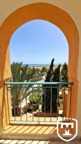 a view of the beach from a balcony at Alhambra Thalasso in Hammamet