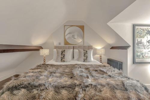 En eller flere senge i et værelse på Matchstick Cottage