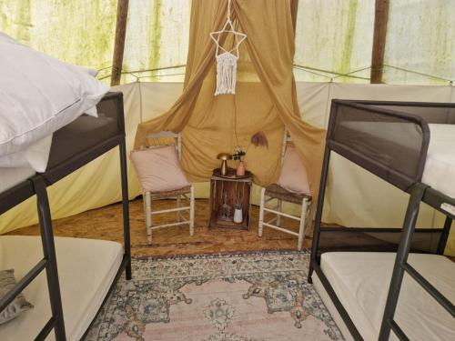 Postel nebo postele na pokoji v ubytování Tipi Luna