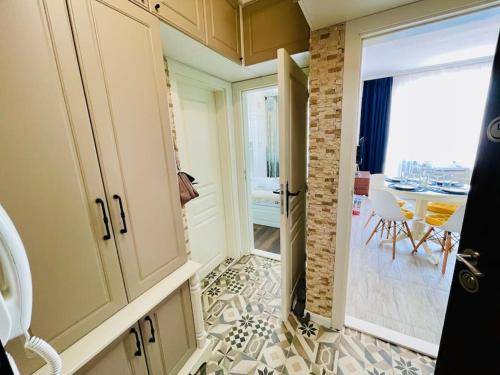 a kitchen with a door leading to a dining room at Positano in Varna City