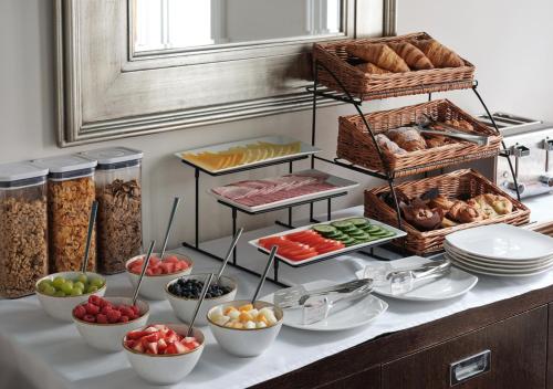 a buffet with different types of food on a counter at Montagu Place Hotel in London
