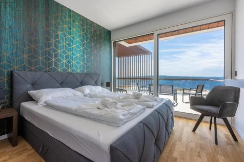 En eller flere senge i et værelse på Villa Carolea