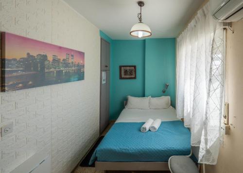a room with a bed with two white pillows on it at Breezot Yam in Nahariyya