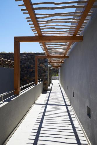 a hallway of a building with a wooden ceiling at Cayo Exclusive Resort & Spa in Elounda
