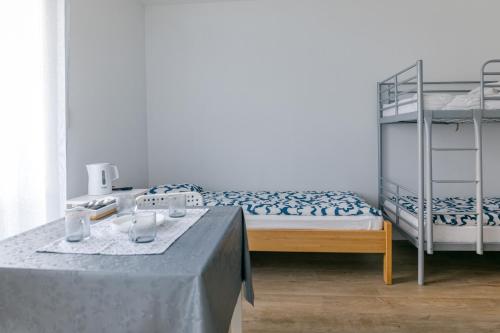 Ένα ή περισσότερα κρεβάτια σε δωμάτιο στο Pokoje MASZOP