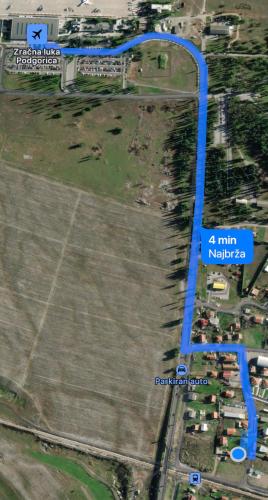 a map of a field with a blue line at Apartment Airport DD in Mitrovići