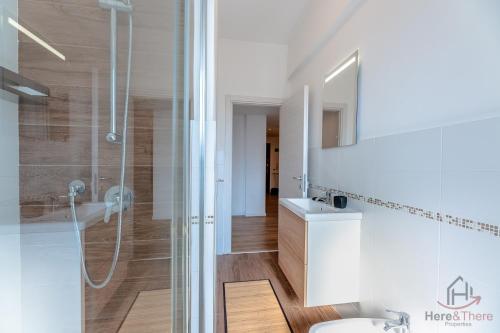 a bathroom with a shower and a sink at Penthouse panoramic view - Sea 3min - AC - WiFi in Albisola Superiore