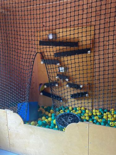 a cage with a bunch of balls in it at Villa Styria in Bad Aussee