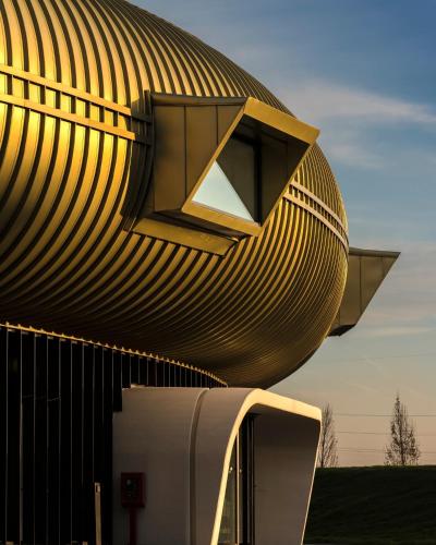a building with a curved roof on top of it at Foresteria San Niccolò in Prato