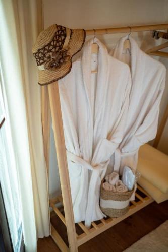 a closet with a white robe on a shelf at Kraljeva Kruna - kuća za odmor in Koprivnica