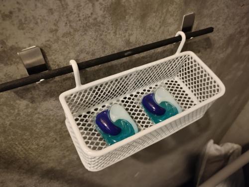 a basket with two blue and white tooth brushes at NorthHisath-Susukino in Sapporo