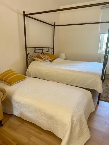 two beds sitting next to each other in a room at Nature Nest in Prague