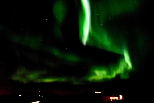 an image of the northern lights in the sky at Northern lights Luxury with hot tub! 10 min to city in Mosfellsbær