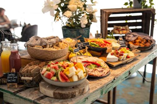 a table topped with lots of different types of food at Radisson Blu Hotel Uppsala in Uppsala