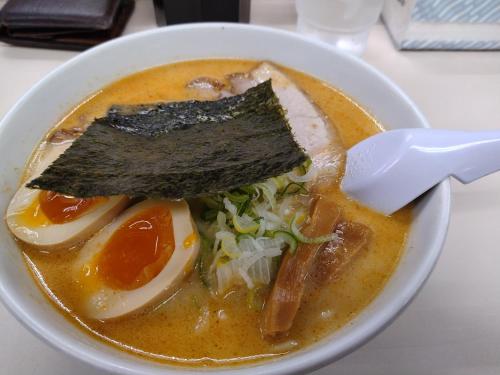 a bowl of soup with a piece of meat on top at NorthHisath-Susukino in Sapporo