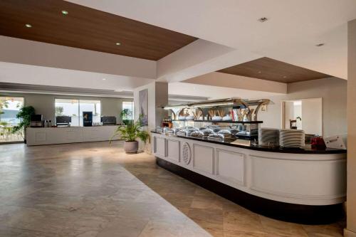 a kitchen with a counter with pots and pans at Dolce by Wyndham Cesme Alacati in Izmir