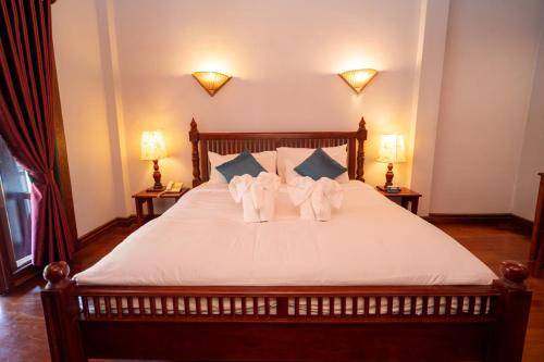 Cama o camas de una habitación en Muangthong Boutique Hotel
