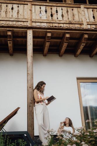 a bride is standing in front of a mirror at Luxury Chalets Gradenbach near Schladming in Haus im Ennstal